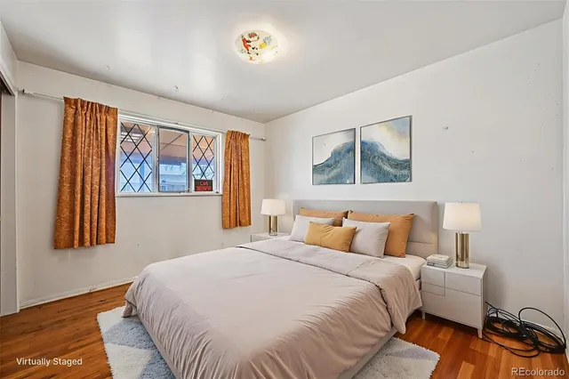 a bedroom with a large bed and a window