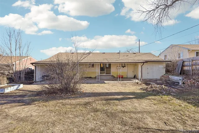 a view of a house with a snow in the background