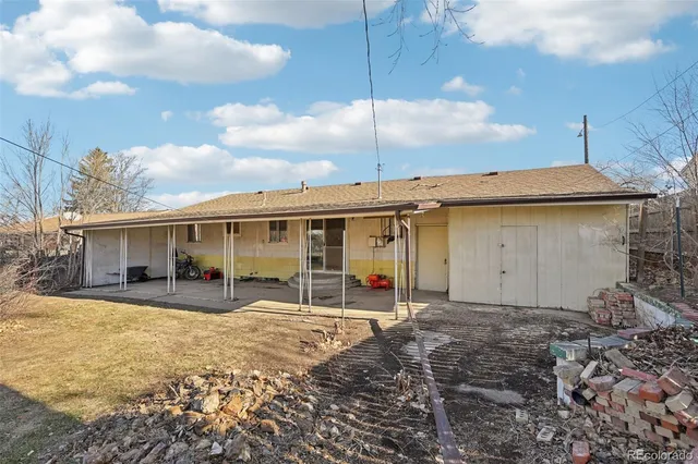 a front view of a house with a yard and seating space
