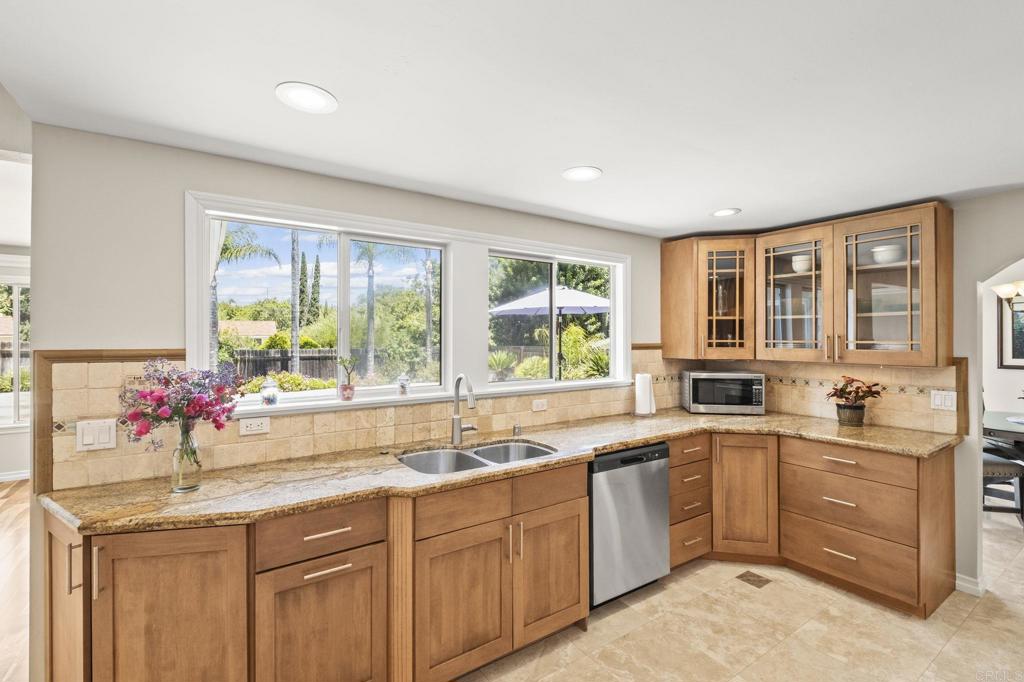1973 Felicita Road Escondido, CA 92025 - Photo 17 of 55 a kitchen with a sink stove and cabinets