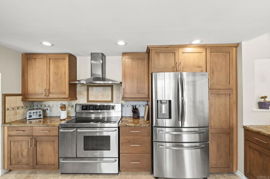 1973 Felicita Road Escondido, CA 92025 - Photo 18 of 55 a kitchen with stainless steel appliances granite countertop a refrigerator stove and sink
