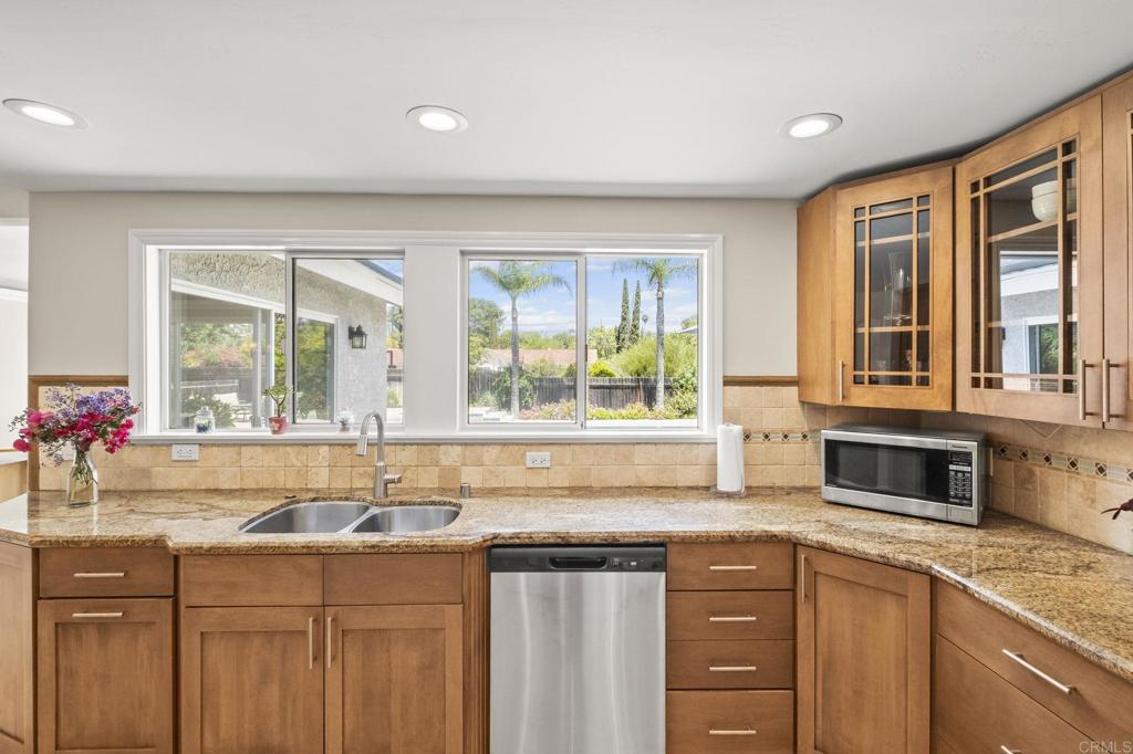 1973 Felicita Road Escondido, CA 92025 - Photo 19 of 55 a kitchen with a sink stove and cabinets