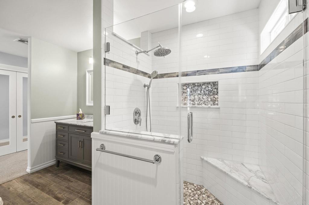 1973 Felicita Road Escondido, CA 92025 - Photo 25 of 55 a bathroom with a bathtub a shower a sink and vanity