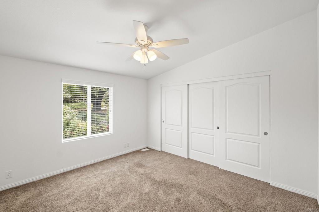1973 Felicita Road Escondido, CA 92025 - Photo 49 of 55 an empty room with windows and fan
