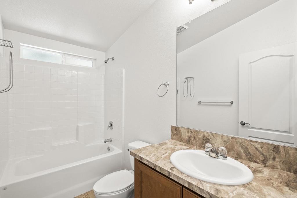 1973 Felicita Road Escondido, CA 92025 - Photo 50 of 55 a bathroom with a sink toilet and shower