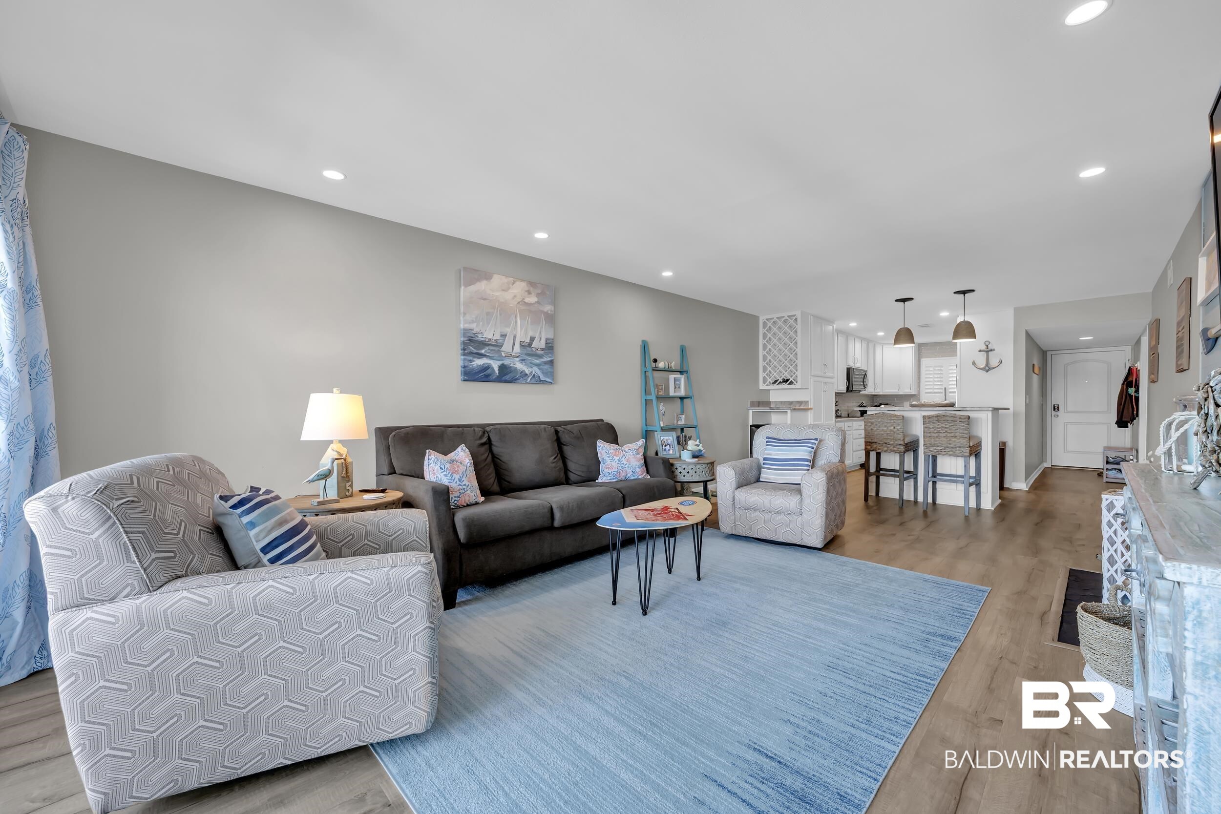 14100 River Road, Unit 211 Pensacola, FL 32507 - Photo 13 of 56 Open-concept living area featuring wood-finish flooring and recessed lighting