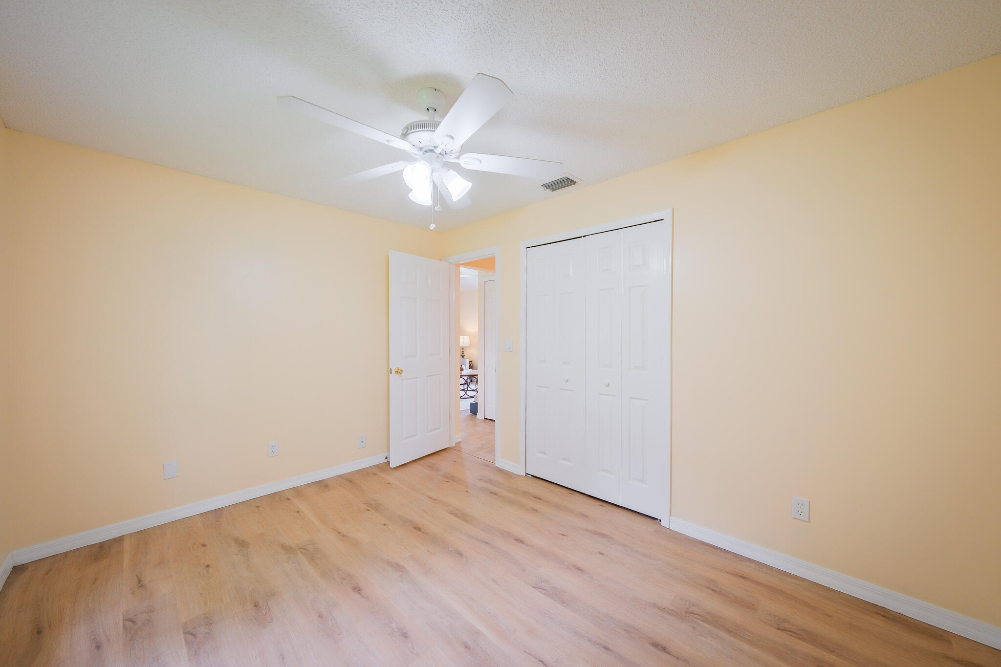 762 Gerlitz Road Southwest Palm Bay, FL 32908 - Photo 19 of 29 an empty room with a window and wooden floor