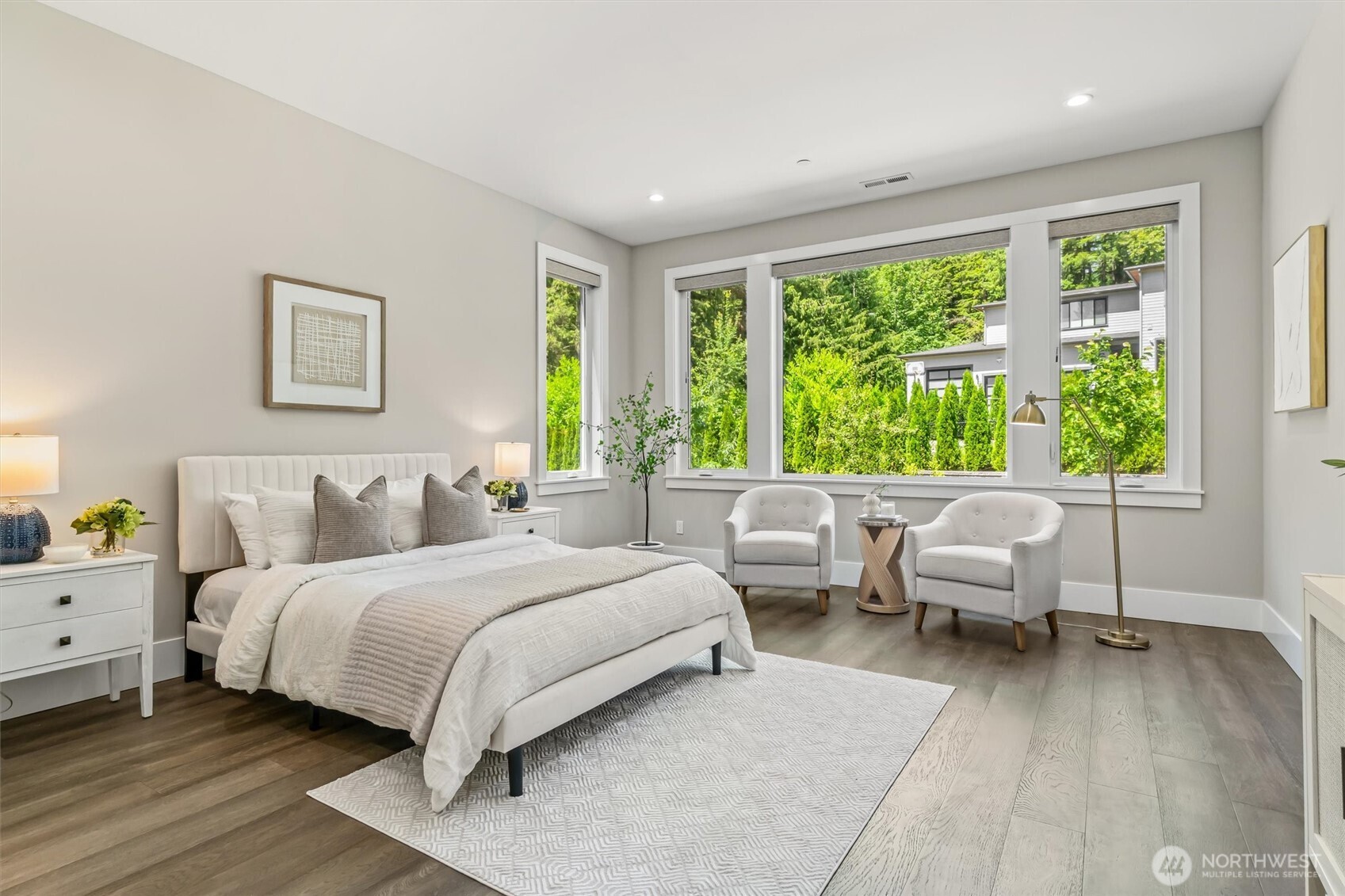 23036 35th Avenue Southeast Bothell, WA 98021 - Photo 17 of 39 a bedroom with a bed and large windows