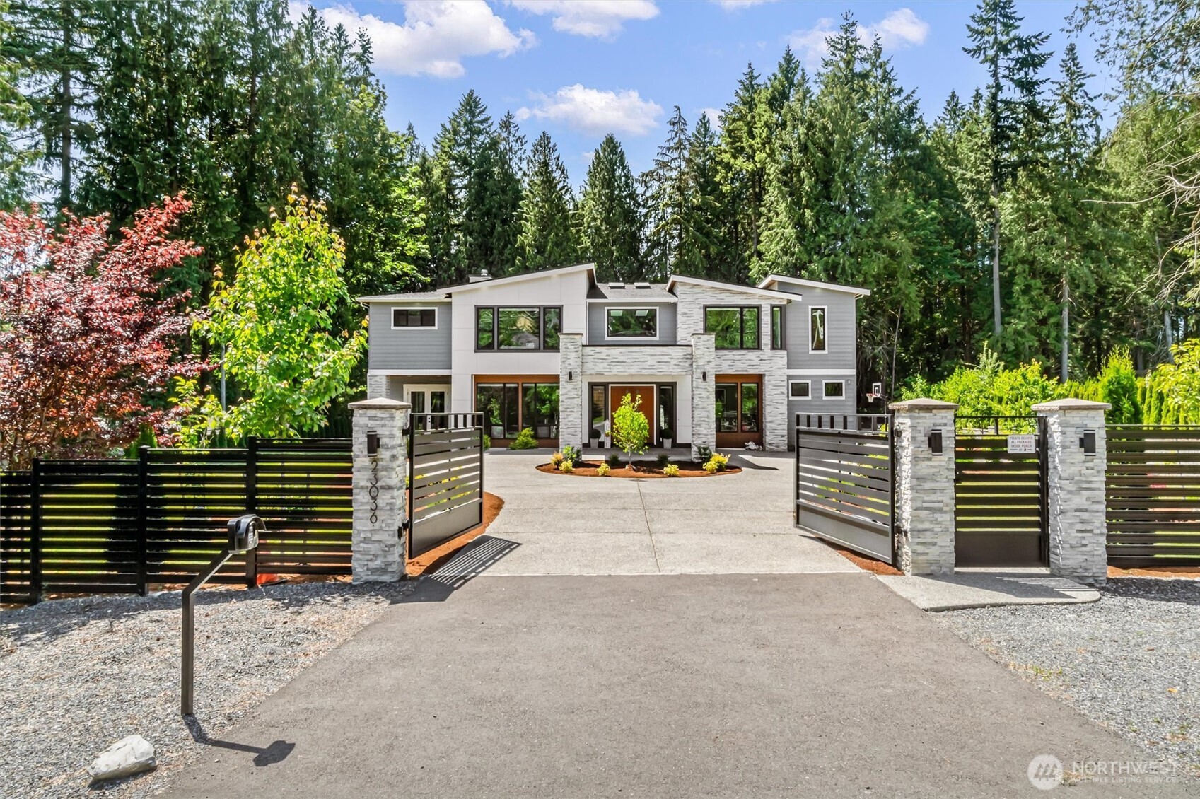 23036 35th Avenue Southeast Bothell, WA 98021 - Photo 3 of 39 a view of a house with a yard and wooden fence