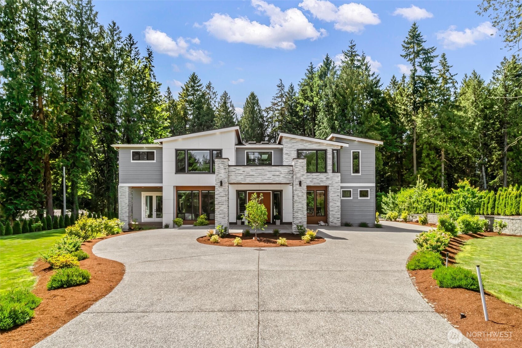 23036 35th Avenue Southeast Bothell, WA 98021 - Photo 36 of 39 a view of a building with potted plants and a yard