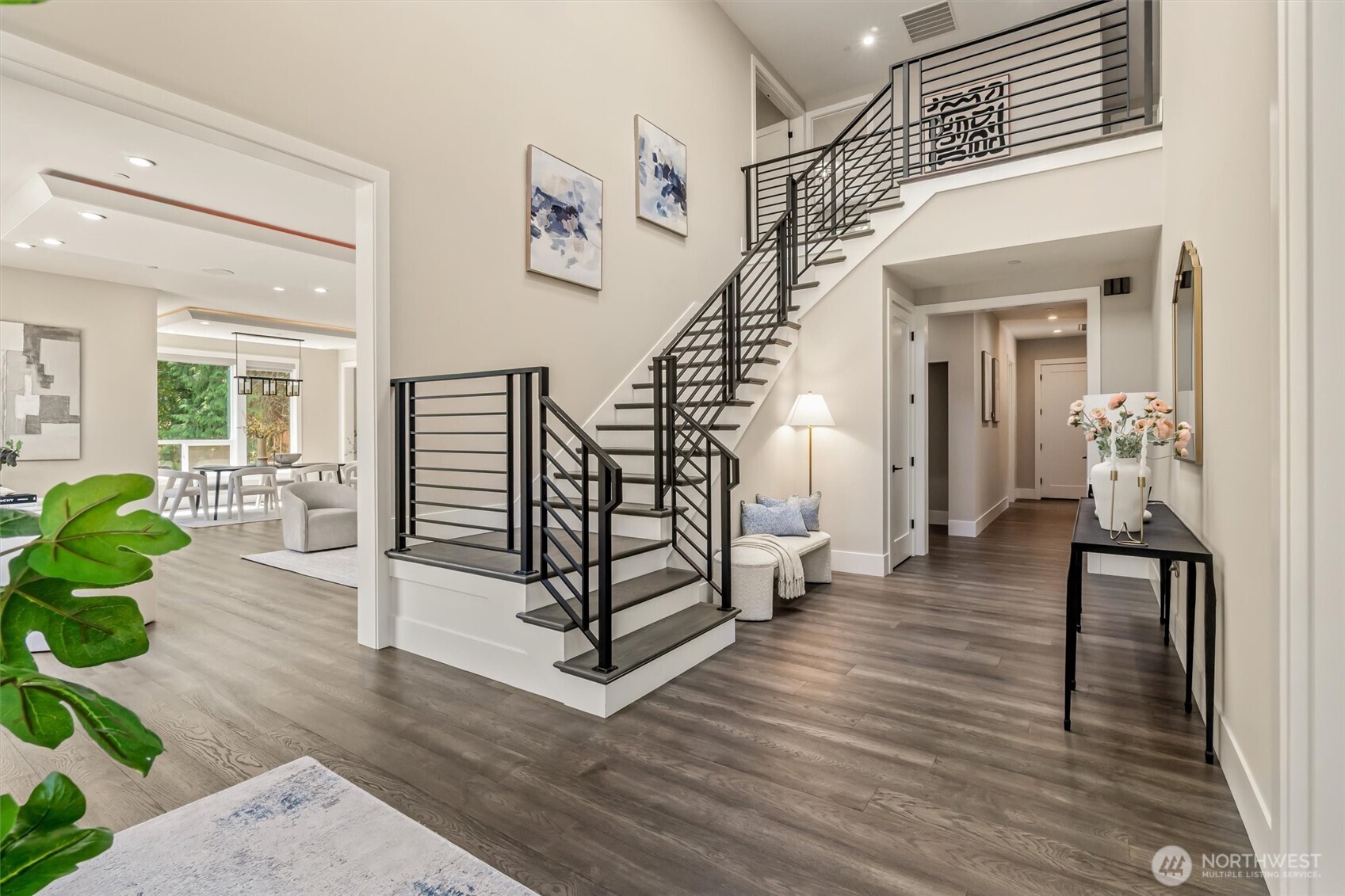 23036 35th Avenue Southeast Bothell, WA 98021 - Photo 5 of 39 a view of a hallway with wooden floor and stairs