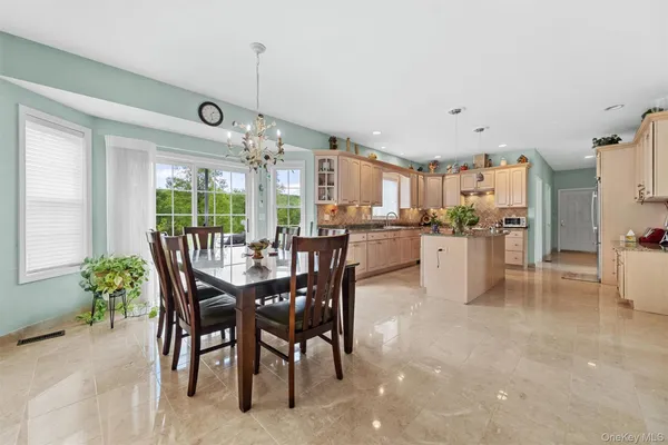 a dining area with furniture and window