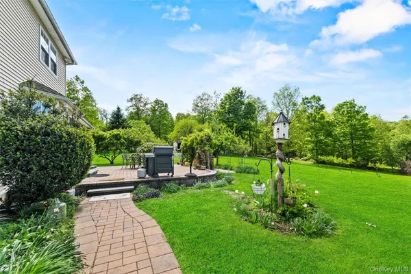 a backyard of a house with lots of green space