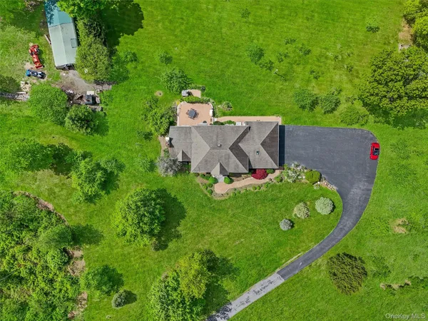 a front view of house with yard and green space