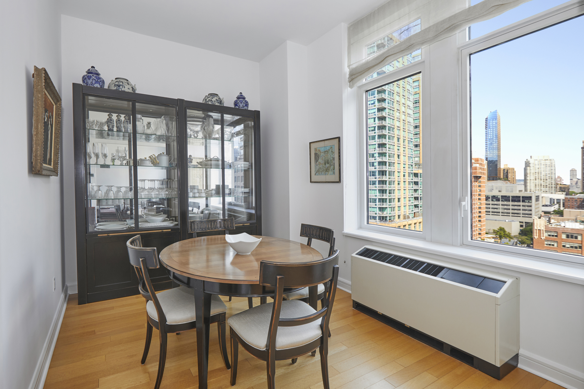 80 Riverside Boulevard, Unit 19B Manhattan, NY 10069 - Photo 5 of 18 a dining room with furniture and window