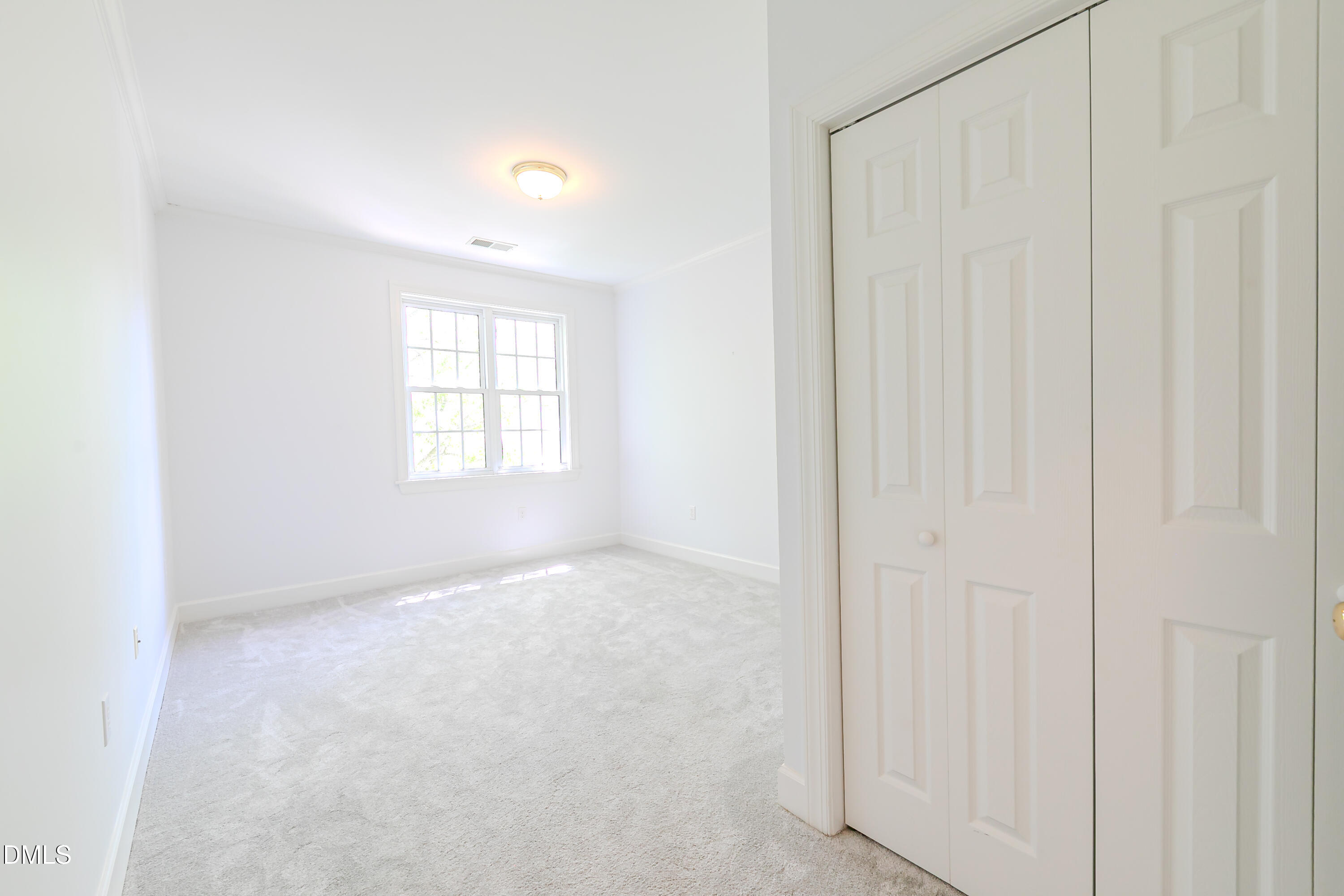116 Northbrook Drive, Unit 305 Raleigh, NC 27609 - Photo 33 of 43 an empty room with windows