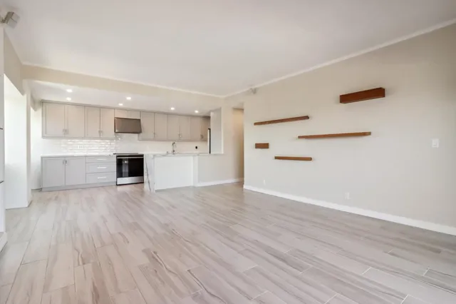 an aerial view of residential building and ocean view