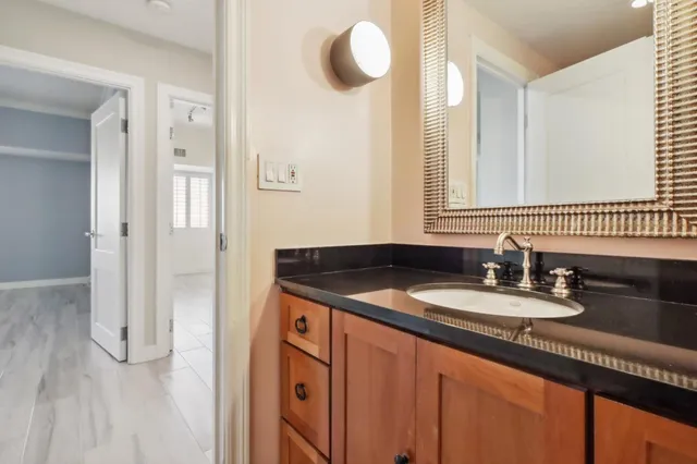 a view of an empty room and wooden floor