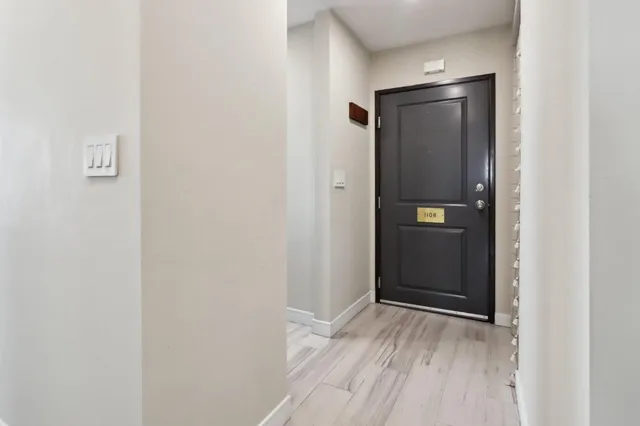 a kitchen with a sink a stove top oven and cabinets