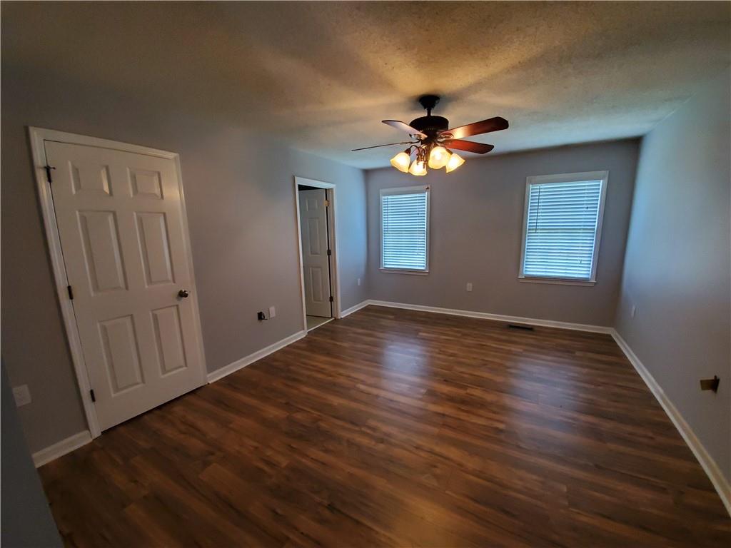 3817 River Road Hickory, NC 28602 - Photo 8 of 13 a view of empty room with wooden floor and fan