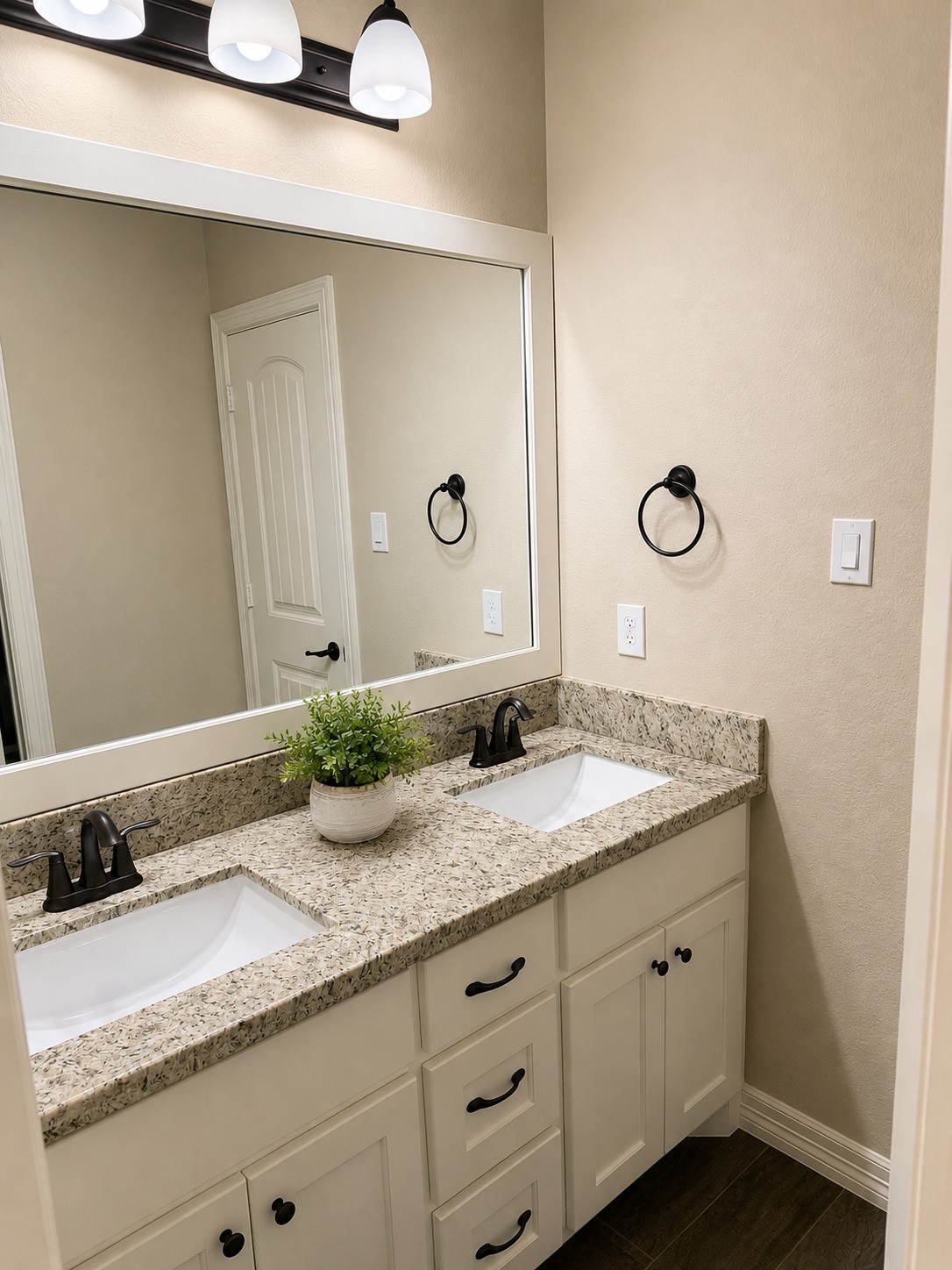 27656 Rio Blanco Drive Splendora, TX 77372 - Photo 17 of 18 This thoughtfully designed Jack-and-Jill bathroom serves adjacent bedrooms seamlessly, boasting a sleek dual-sink vanity with ample counter space.