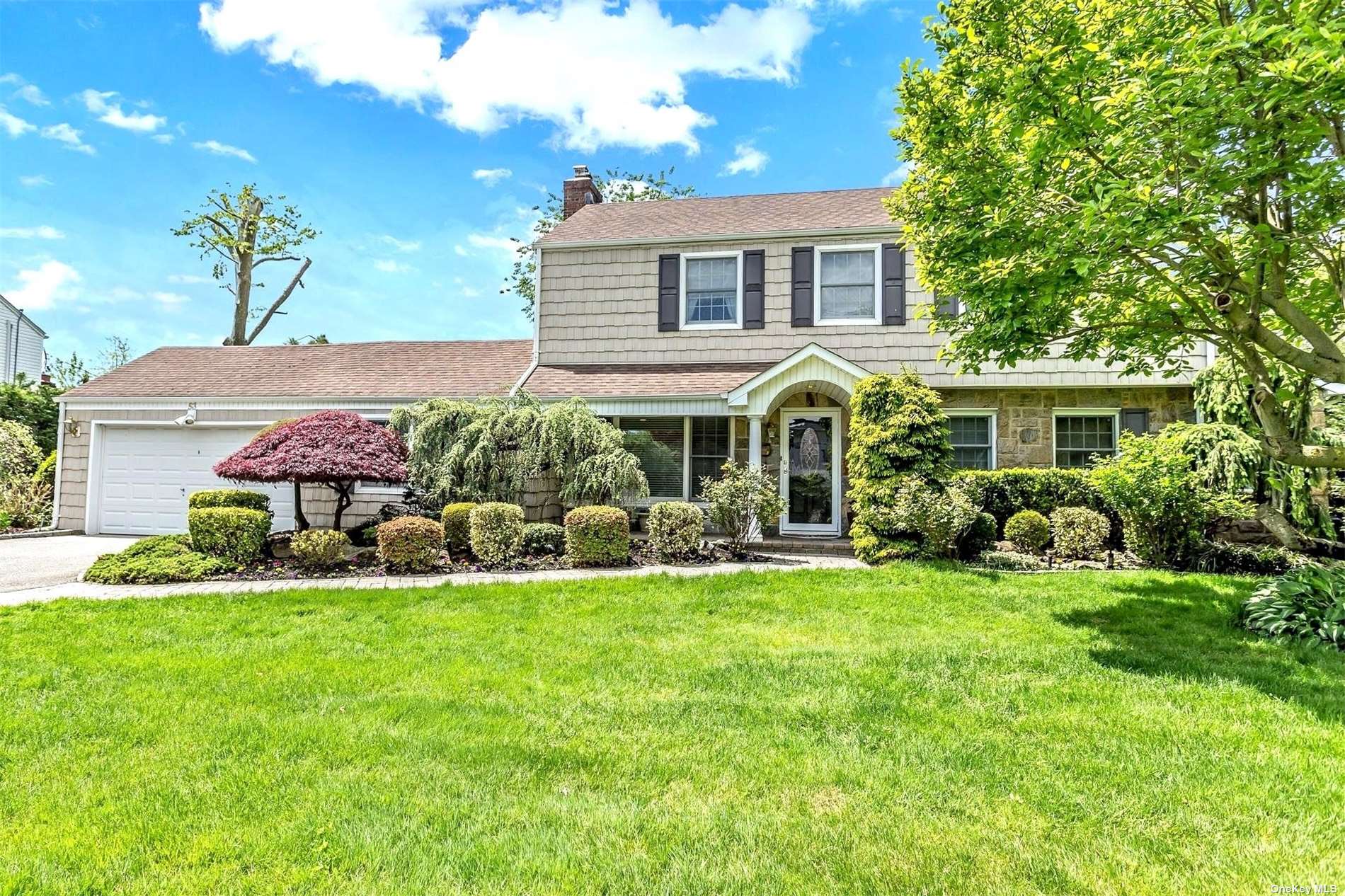 53 Searingtown Road Searingtown, NY 11507 - Photo 1 of 1 a view of a house with a yard and sitting area