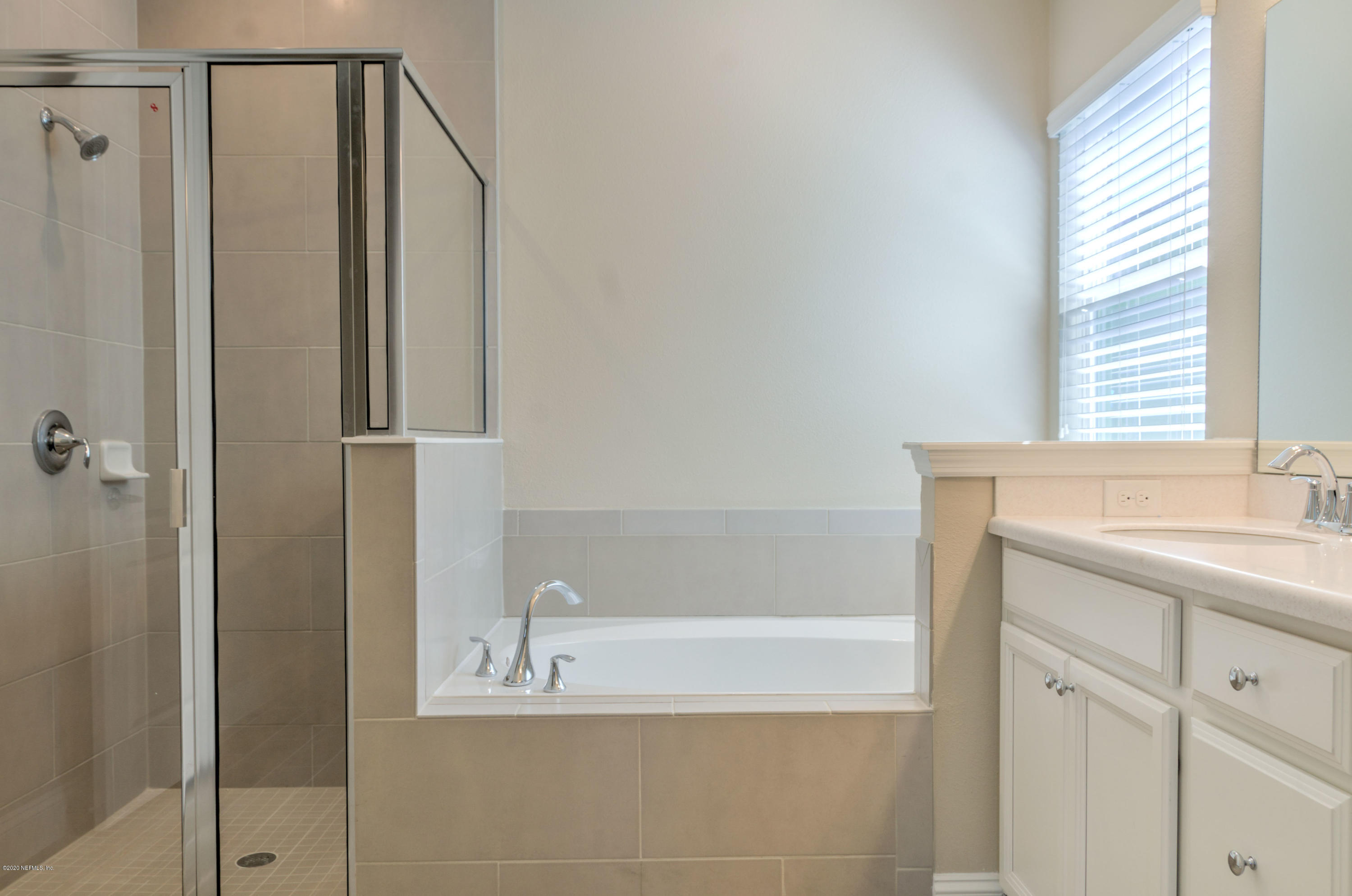 75 Dade Court St. Augustine, FL 32092 - Photo 14 of 25 a bathroom with a shower and a sink