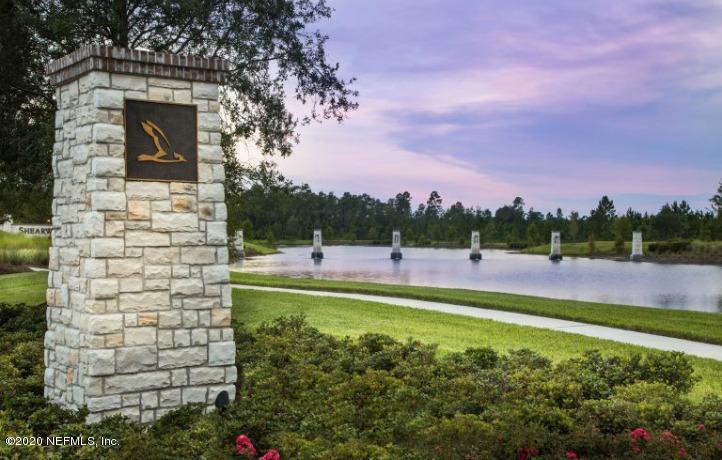 75 Dade Court St. Augustine, FL 32092 - Photo 22 of 25 a view of a lake with a big yard
