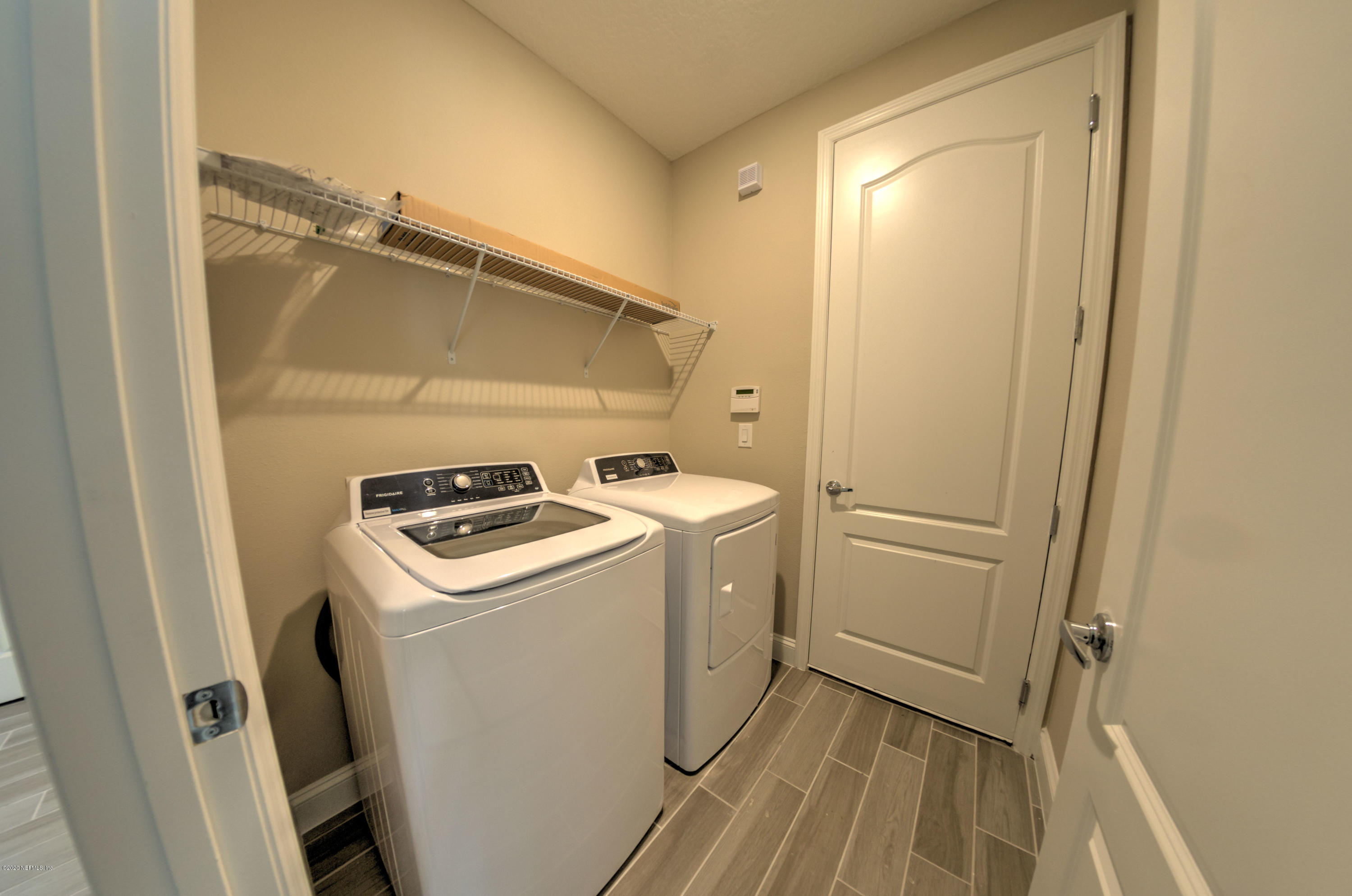 75 Dade Court St. Augustine, FL 32092 - Photo 4 of 25 a utility room with dryer and washer