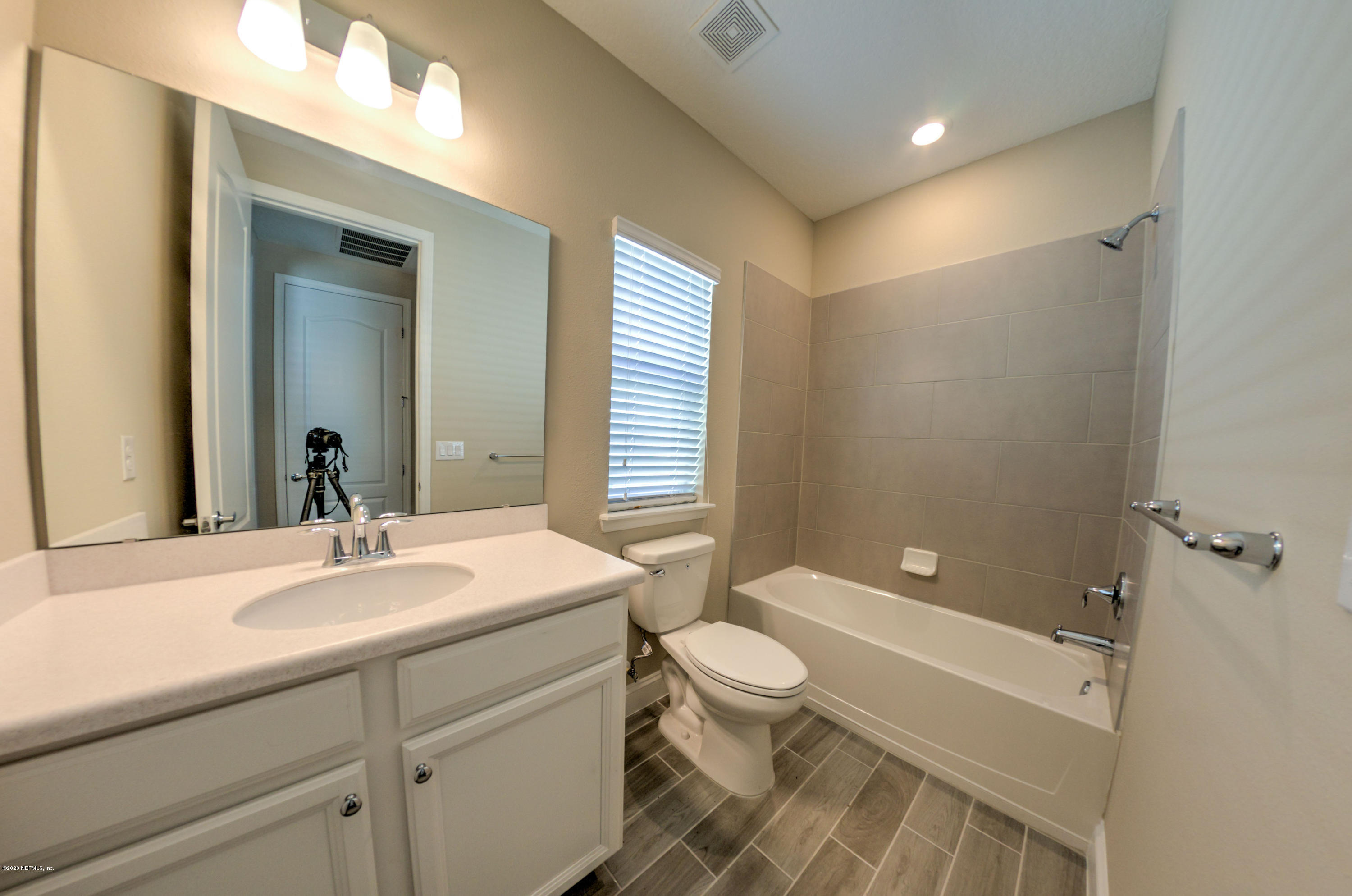 75 Dade Court St. Augustine, FL 32092 - Photo 7 of 25 a bathroom with a sink a toilet and shower