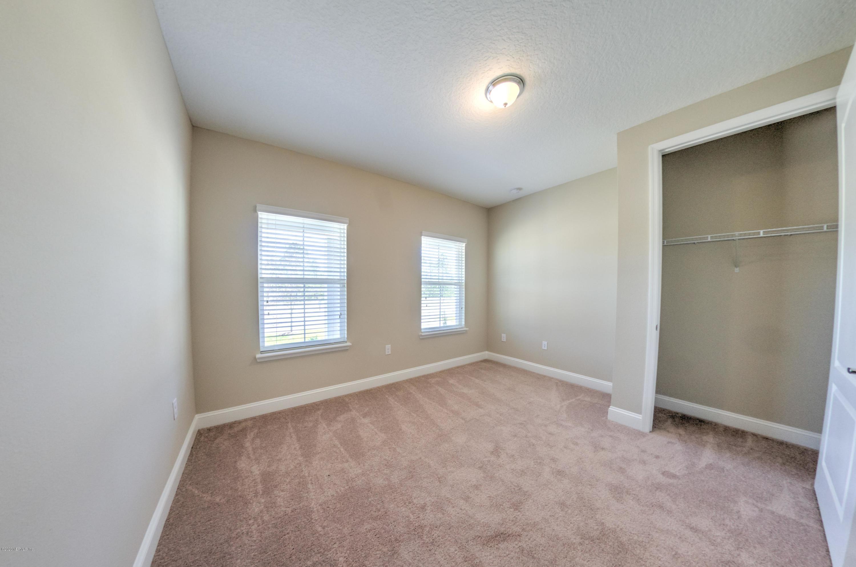 75 Dade Court St. Augustine, FL 32092 - Photo 9 of 25 an empty room with windows