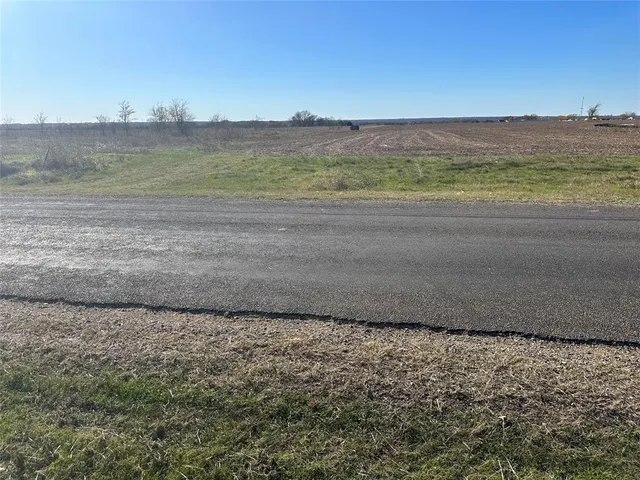 a view of a yard with an ocean
