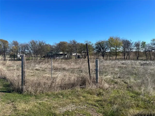 a view of a yard next to a yard