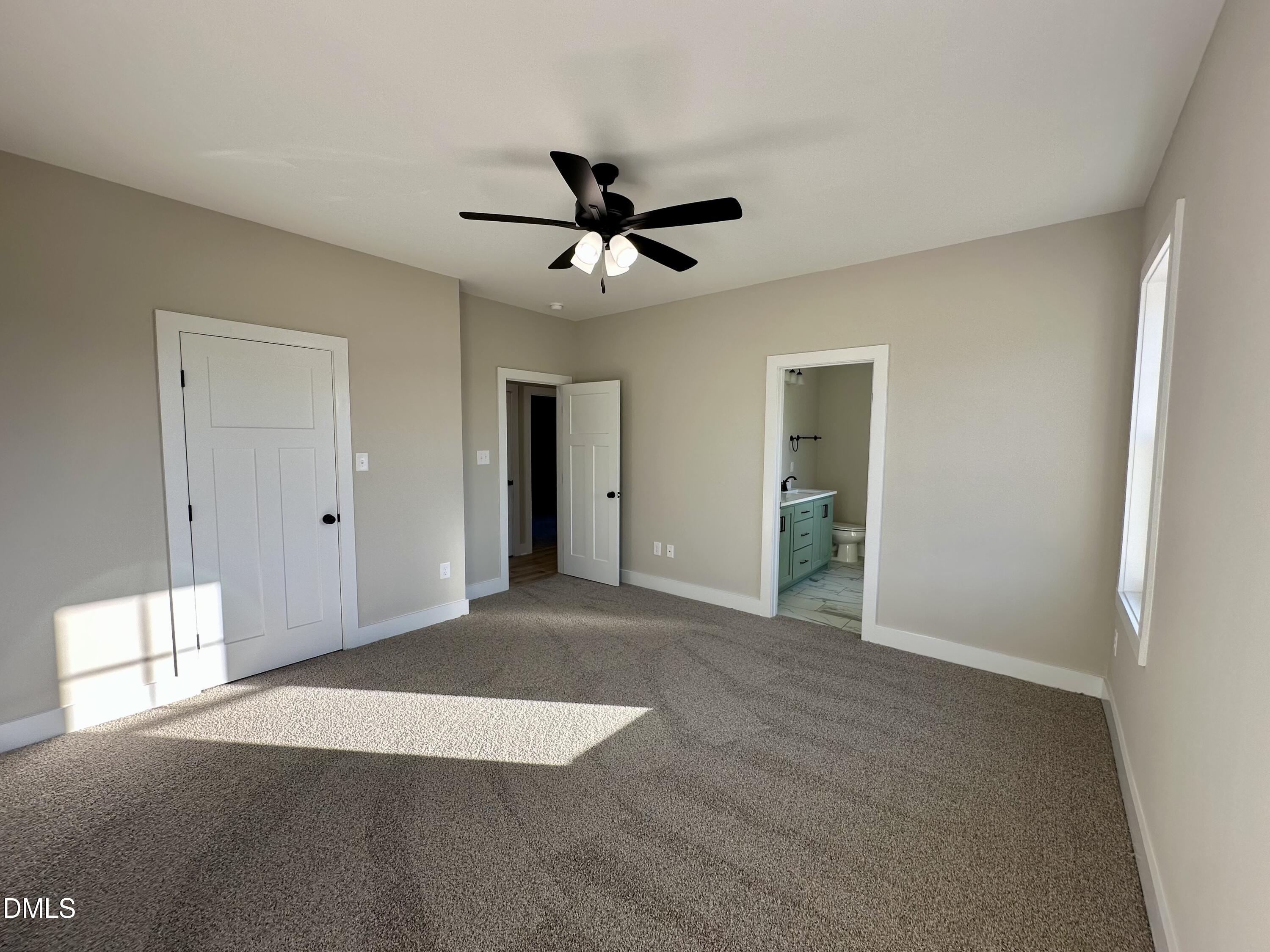 165 Bay Valley Road Kenly, NC 27542 - Photo 10 of 22 a view of a livingroom with a ceiling fan and window