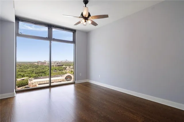 a view of a room with wooden floor and balcony