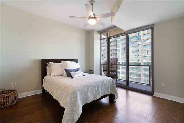 a bedroom with a large bed and a large window