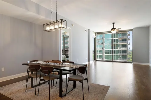 a view of a dining room with furniture window and wooden floor