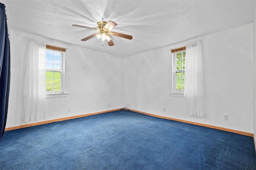 3212 Millers Run Road Cecil, PA 15321 - Photo 11 of 25 an empty room with windows and fan
