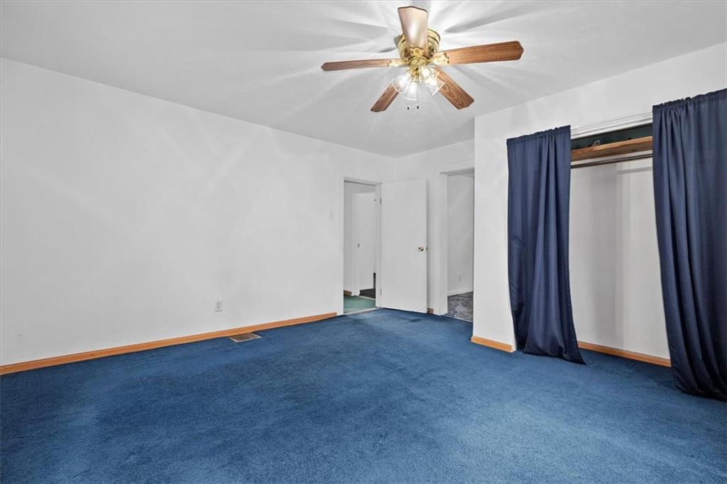 3212 Millers Run Road Cecil, PA 15321 - Photo 12 of 25 an empty room with closet and a ceiling fan