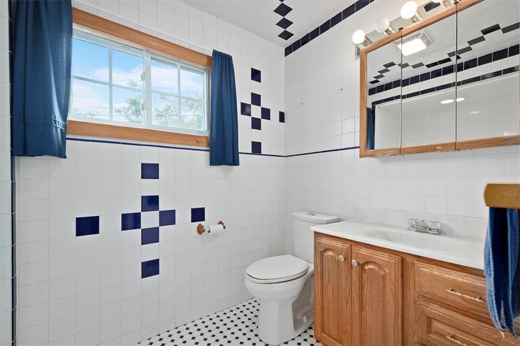 3212 Millers Run Road Cecil, PA 15321 - Photo 14 of 25 a bathroom with a sink a toilet and shower