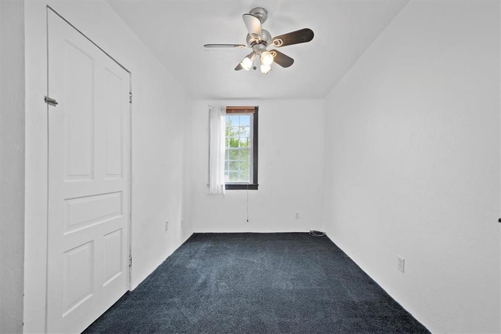 3212 Millers Run Road Cecil, PA 15321 - Photo 18 of 25 an empty room with a window and a ceiling fan