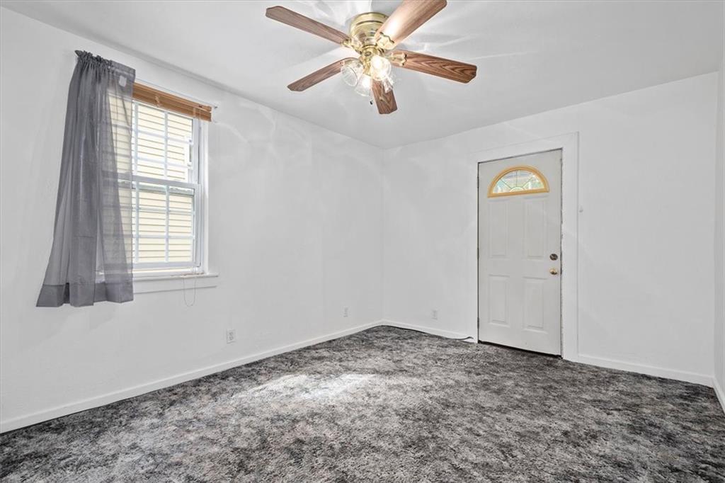 3212 Millers Run Road Cecil, PA 15321 - Photo 19 of 25 a view of a livingroom with a window and a ceiling fan