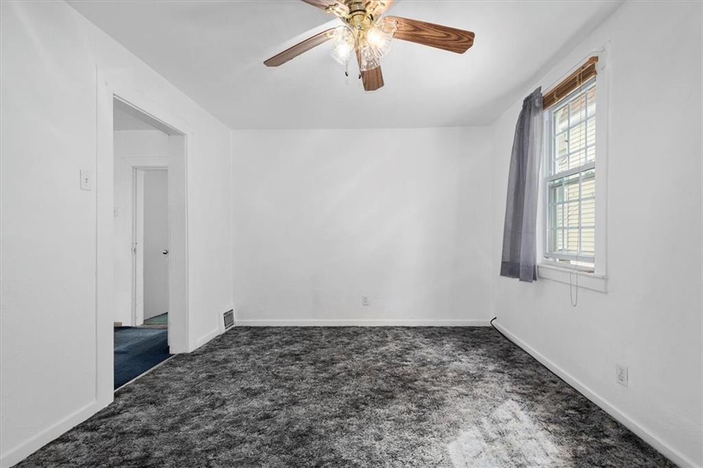 3212 Millers Run Road Cecil, PA 15321 - Photo 20 of 25 an empty room with windows and fan