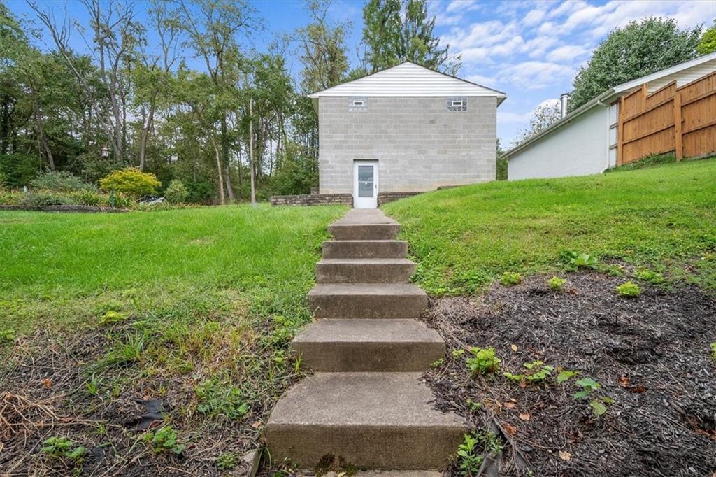 3212 Millers Run Road Cecil, PA 15321 - Photo 22 of 25 a front view of a house with a yard