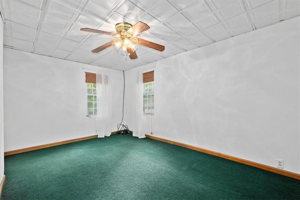 3212 Millers Run Road Cecil, PA 15321 - Photo 6 of 25 an empty room with windows and fan
