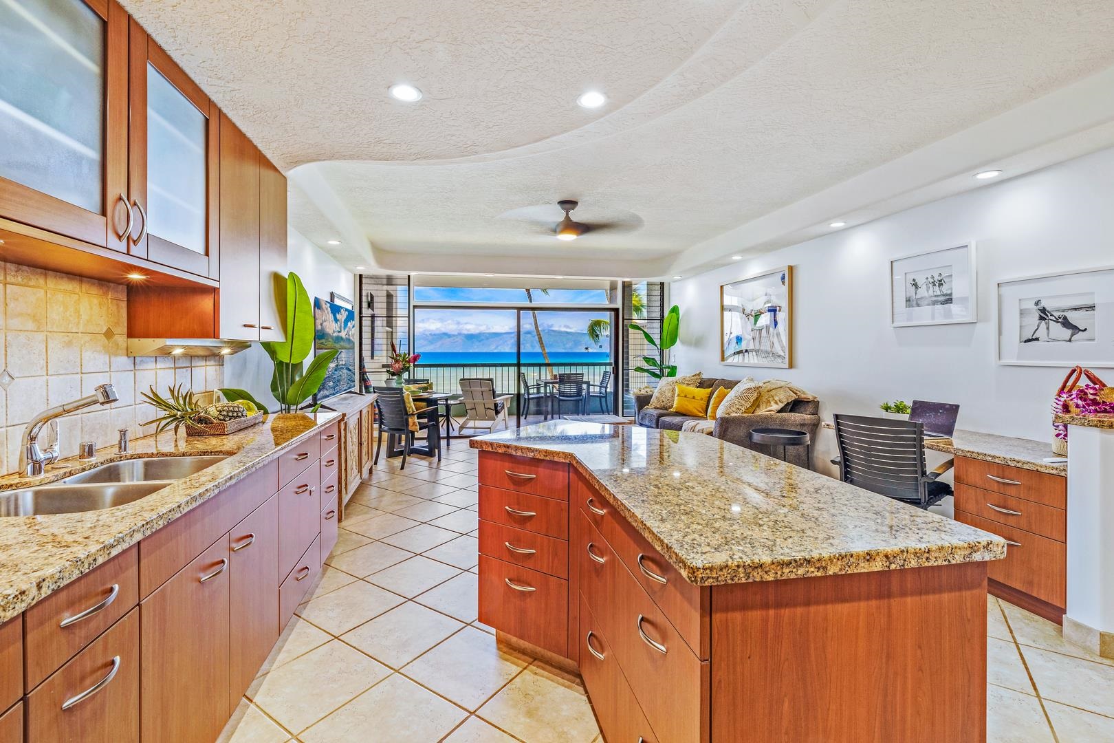 3875 Lower Honoapiilani Road, Unit B305 Lahaina, HI 96761 - Photo 10 of 35 a kitchen with stainless steel appliances granite countertop sink stove and refrigerator