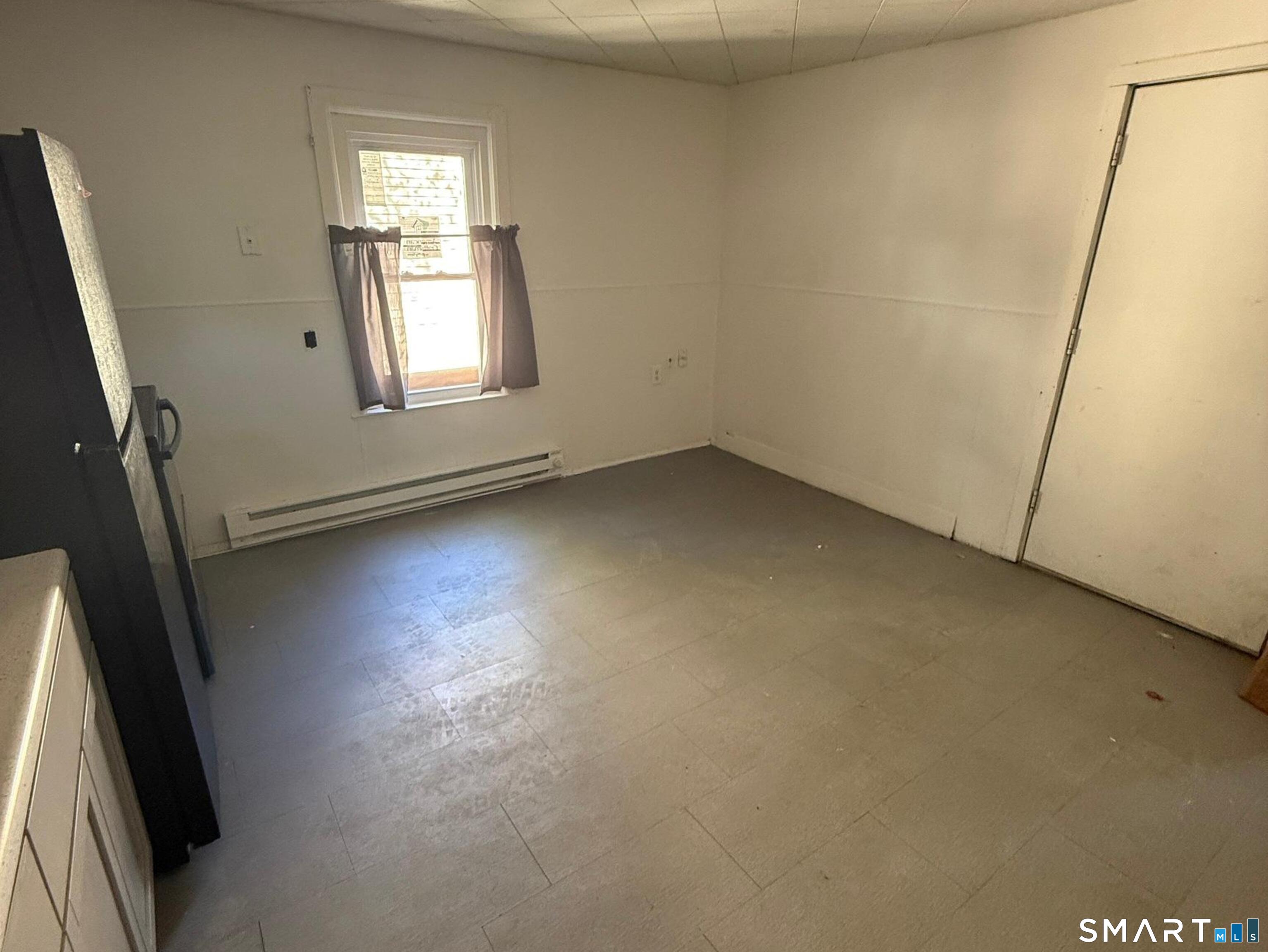 33 Olive Street Meriden, CT 06450 - Photo 3 of 10 an empty room with windows