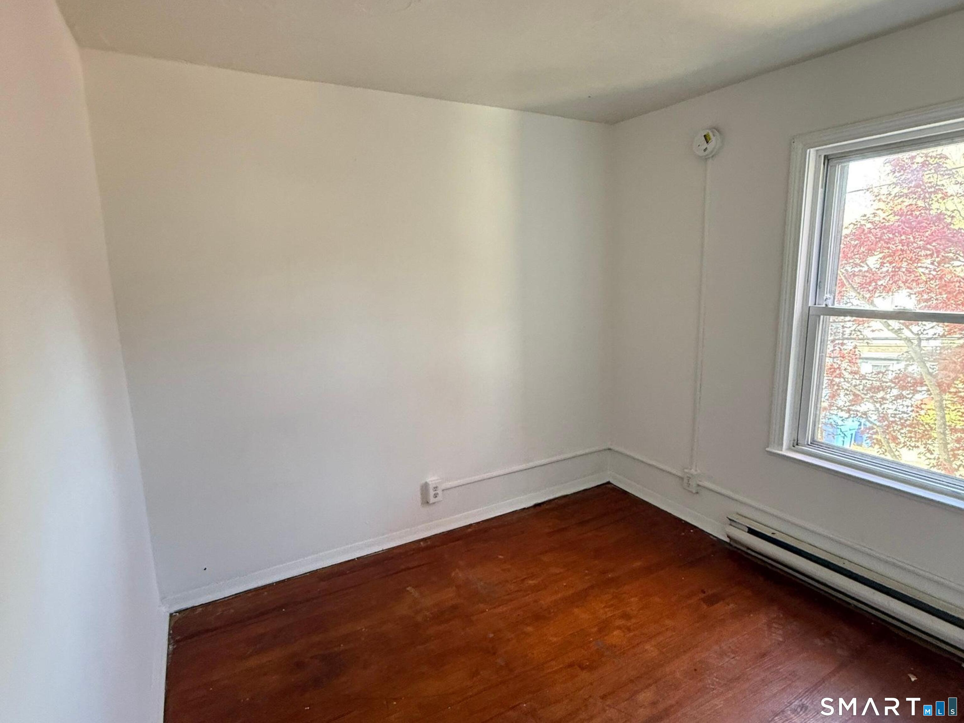33 Olive Street Meriden, CT 06450 - Photo 5 of 10 an empty room with a window