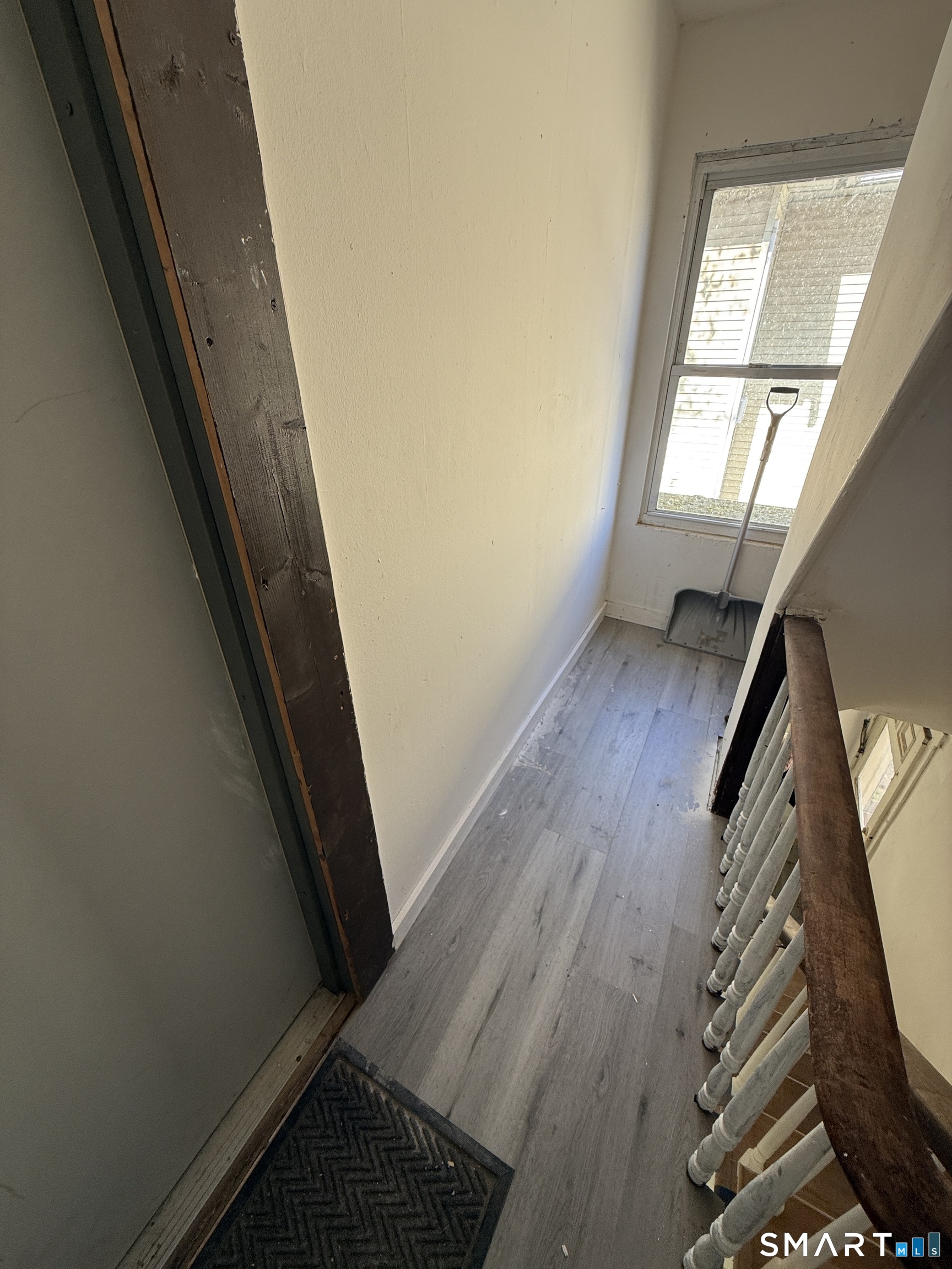 33 Olive Street Meriden, CT 06450 - Photo 8 of 10 a view of stairs with wooden floor