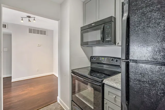 a close view of a stove and a microwave